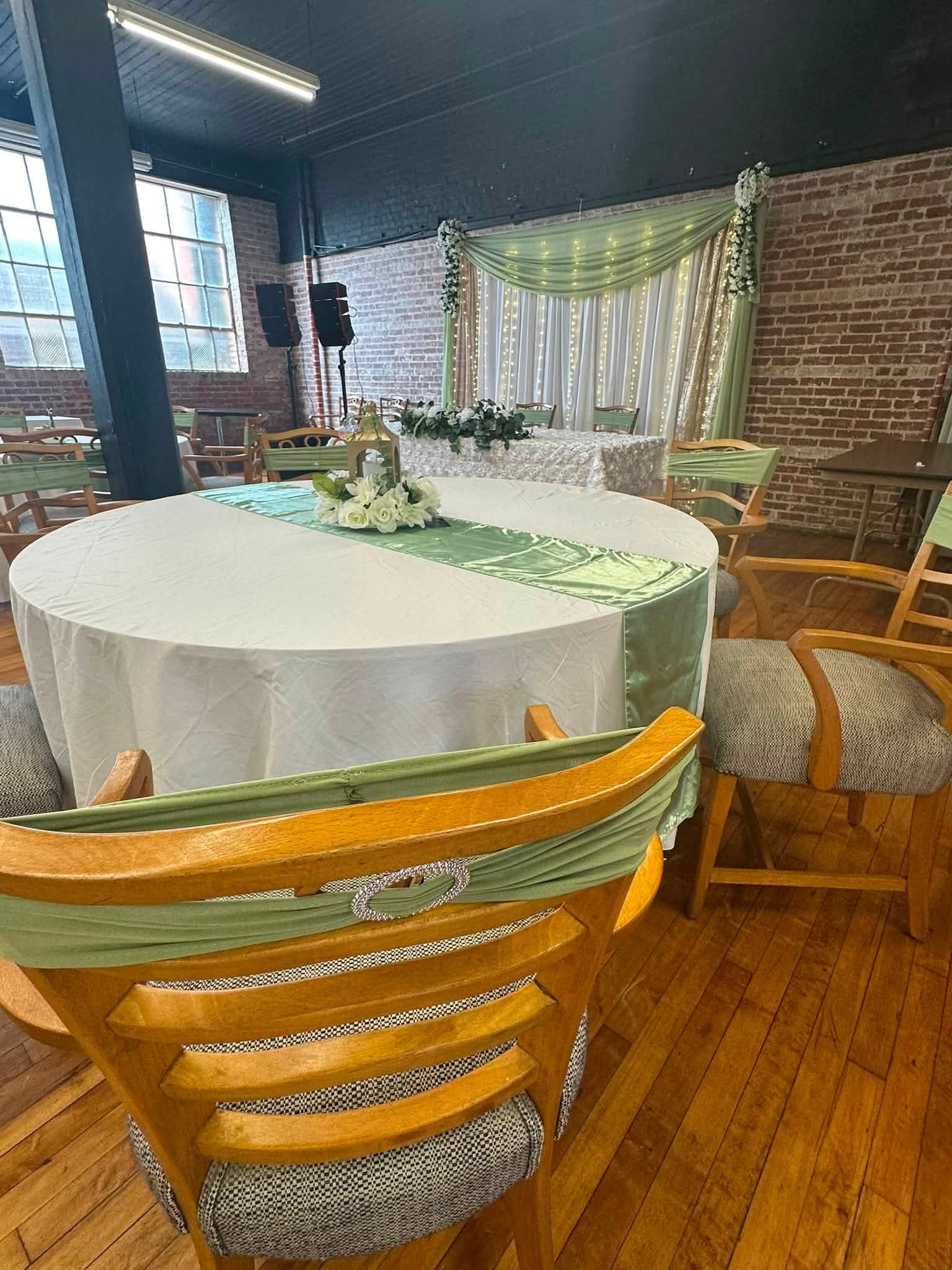 Wedding reception table with runner and centerpiece at an event space in Cambridge Maryland